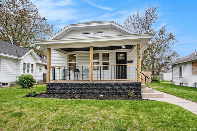 714 S 25th St, South Bend, IN 46615 - view of front of property featuring a porch and a front lawn