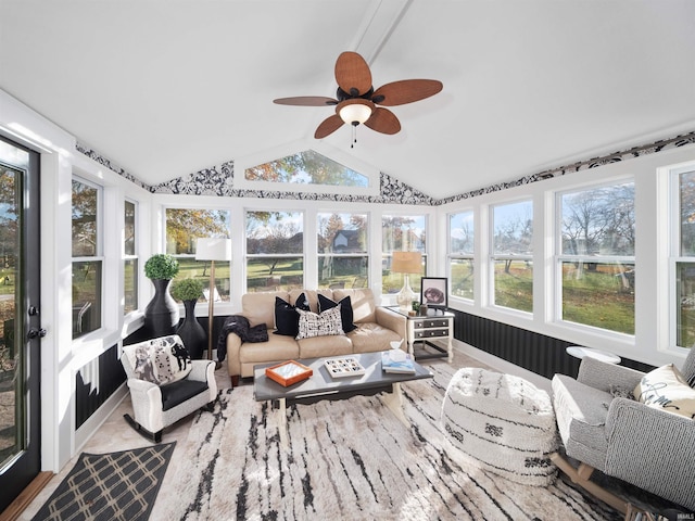sunroom / solarium featuring outdoor lounge area, a ceiling fan, and lofted ceiling
