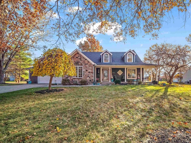 cape cod home featuring a porch, driveway, and a front yard