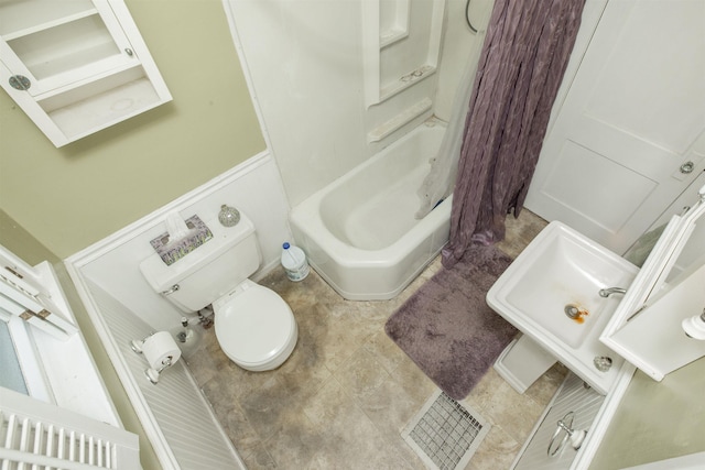 bathroom with washtub / shower combination and toilet