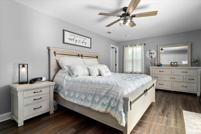 bedroom featuring baseboards, a ceiling fan, dark wood-type flooring, and visible vents