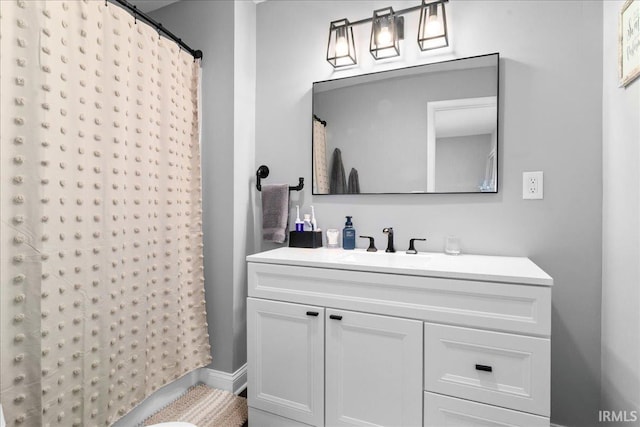 bathroom with vanity and a shower with shower curtain