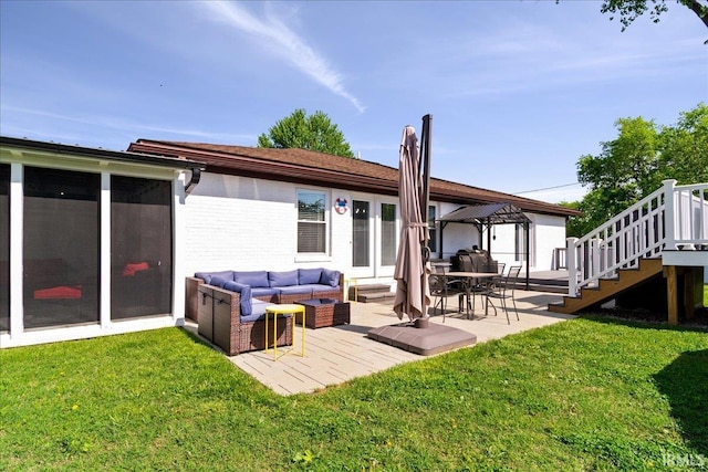 back of property with a gazebo, a yard, outdoor lounge area, and brick siding