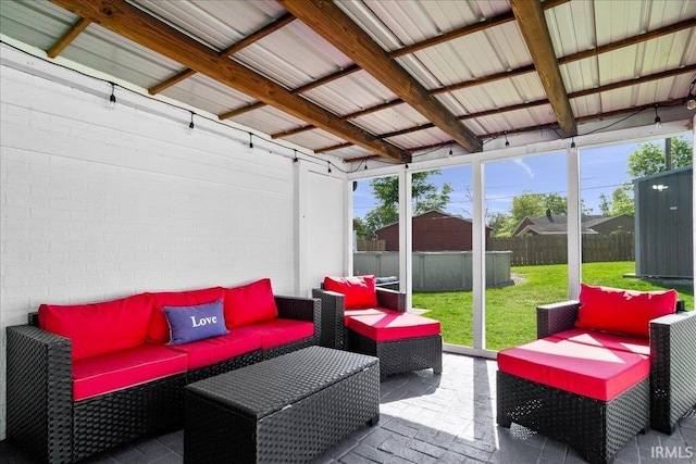 sunroom featuring outdoor lounge area