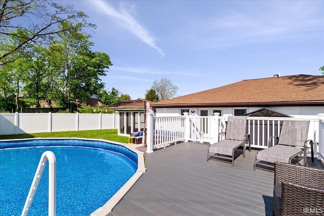 view of pool featuring a fenced in pool, a wooden deck, and fence