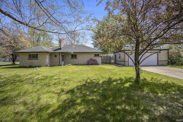 exterior space featuring a garage, a front lawn, fence, and a chimney