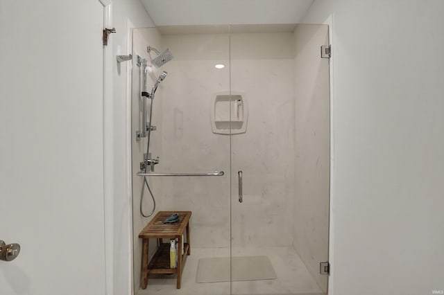 full bath with a marble finish shower