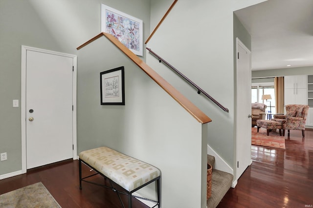 entrance foyer featuring stairs and wood finished floors