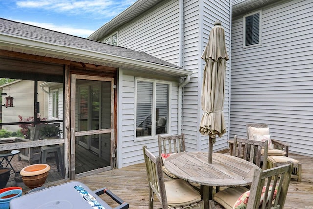 wooden deck featuring outdoor dining area
