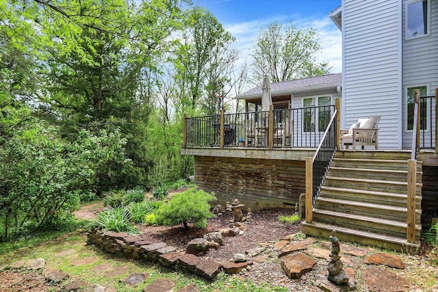 view of yard with a wooden deck and stairway