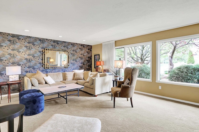 carpeted living room featuring baseboards, recessed lighting, and wallpapered walls