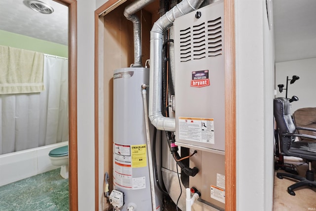 utilities featuring visible vents and gas water heater