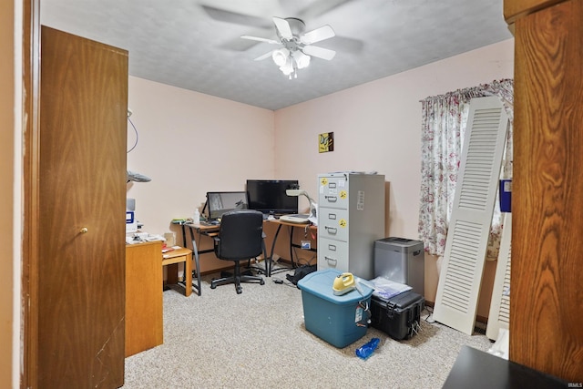 office area with carpet flooring and a ceiling fan
