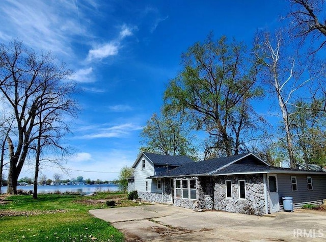 3566 W Sycamore Ln Unit 57, Columbia City, IN 46725 - view of front of home featuring a water view and stone siding
