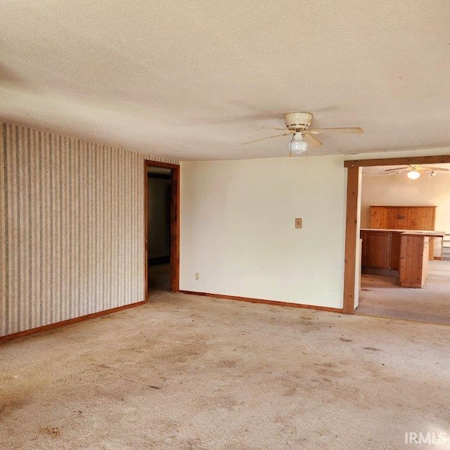3566 W Sycamore Ln Unit 57, Columbia City, IN 46725 - empty room with carpet floors, a textured ceiling, and baseboards
