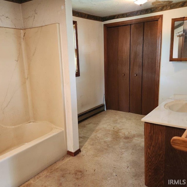 3566 W Sycamore Ln Unit 57, Columbia City, IN 46725 - bathroom with a tub, a baseboard heating unit, carpet, and vanity