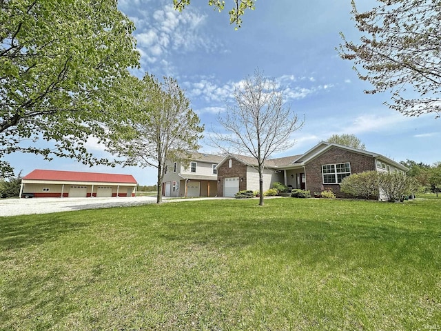 view of front of property with brick siding, gravel driveway, a front lawn, and a garage