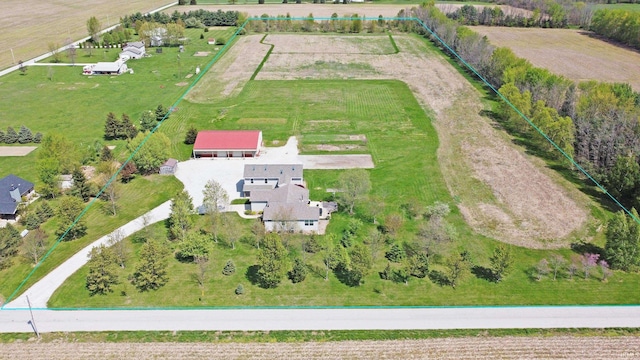 birds eye view of property featuring a rural view
