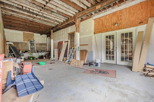 interior space featuring concrete floors and french doors