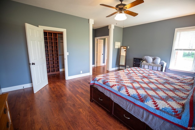 10220 6b Rd, Plymouth, IN 46563 - bedroom featuring dark wood finished floors, a spacious closet, baseboards, and ceiling fan