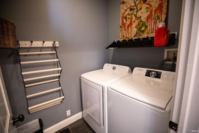 10220 6b Rd, Plymouth, IN 46563 - clothes washing area with washer and clothes dryer, dark tile patterned flooring, and baseboards