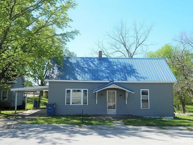 414 17th St, Bedford, IN 47421 - view of front of home featuring metal roof and a carport