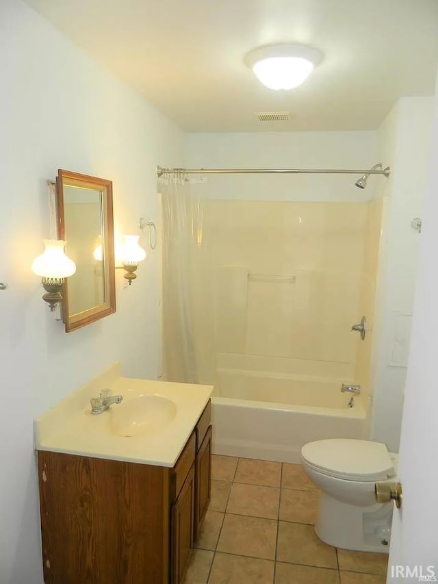 414 17th St, Bedford, IN 47421 - bathroom with visible vents, tile patterned flooring, vanity, shower / bath combination with curtain, and toilet