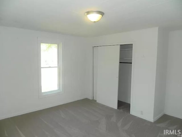 414 17th St, Bedford, IN 47421 - unfurnished bedroom featuring carpet floors and a closet