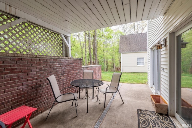 view of patio featuring outdoor dining area