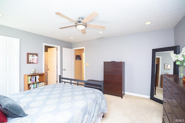 bedroom featuring recessed lighting, baseboards, light colored carpet, and a ceiling fan