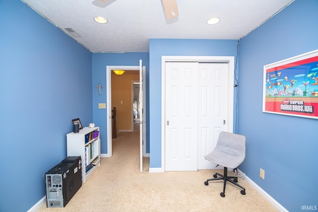 carpeted office space with baseboards, ceiling fan, recessed lighting, and visible vents