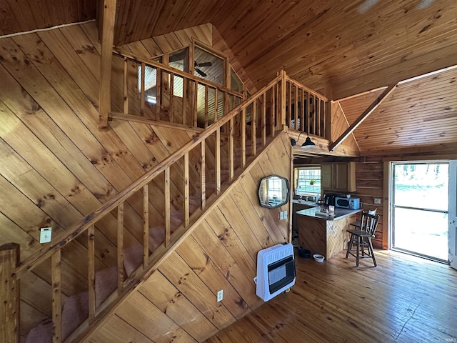 2340 W County Rd 550 S, Paoli, IN 47454 - staircase featuring wood-type flooring, wood walls, wood ceiling, and heating unit