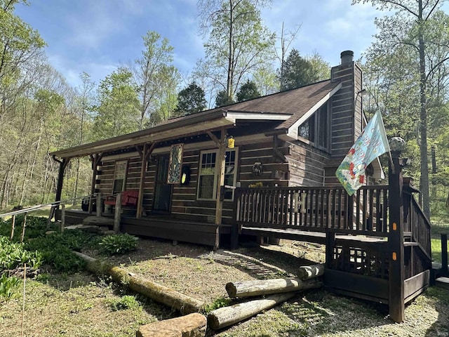 2340 W County Rd 550 S, Paoli, IN 47454 - view of side of property with a porch, log exterior, and a chimney