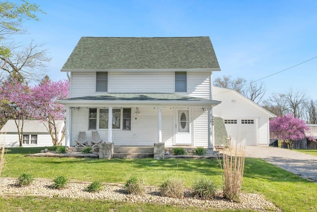 view of front of property featuring roof with shingles, covered porch, an attached garage, and driveway