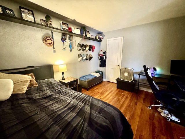 bedroom featuring wood finished floors