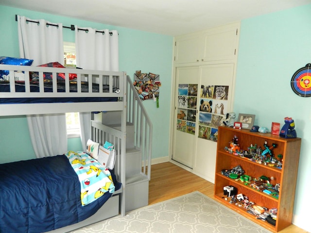 bedroom with wood finished floors