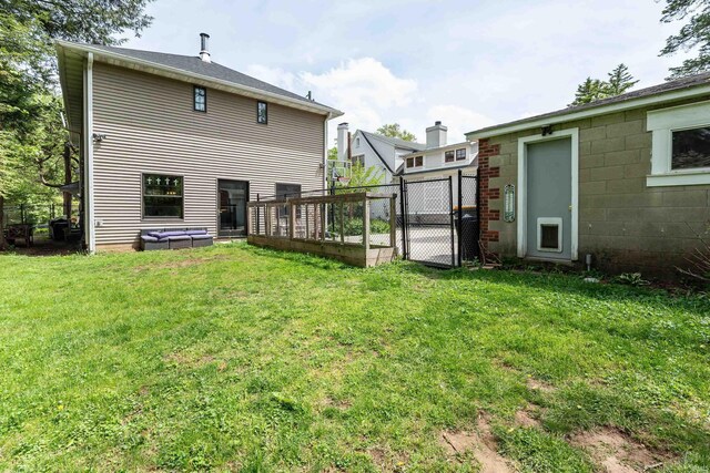 520 S Highland Ave, Bloomington, IN 47401 - rear view of property featuring a lawn, fence, and a gate