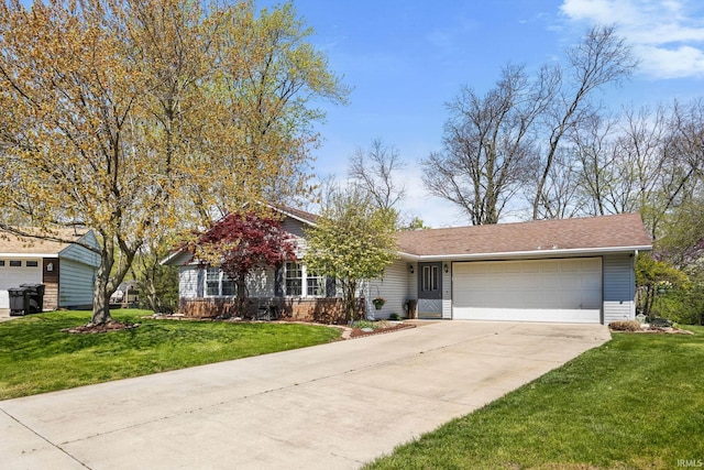 view of front facade with a garage, driveway, and a front yard