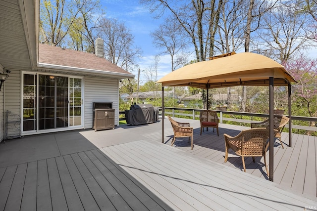 deck featuring a gazebo and a grill