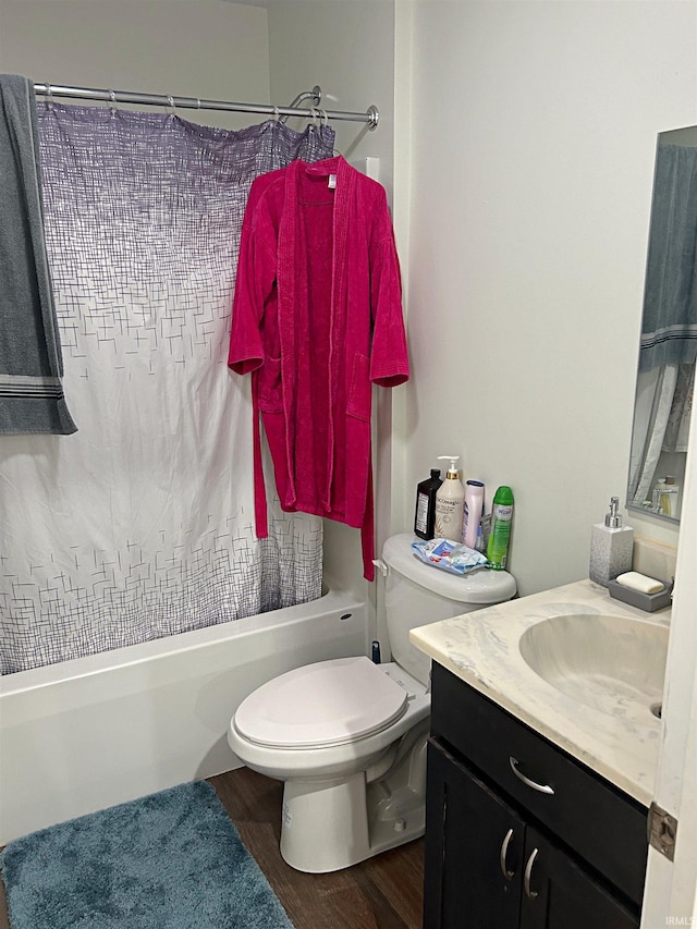 full bathroom with vanity, shower / bathtub combination with curtain, wood finished floors, and toilet