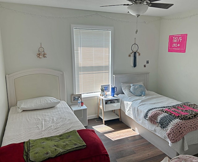 bedroom with a ceiling fan and wood finished floors