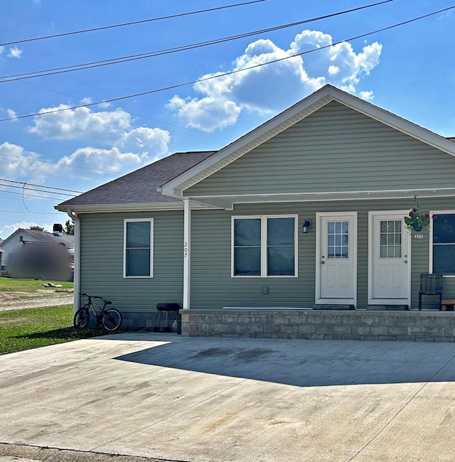 view of front of house featuring a porch and a shingled roof