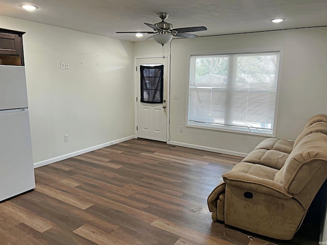 sitting room with baseboards, recessed lighting, dark wood-style flooring, and ceiling fan