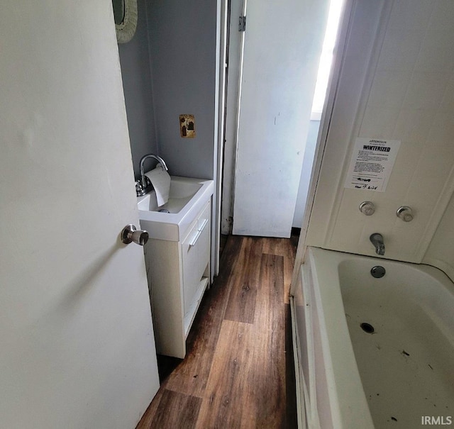 washroom with wood finished floors