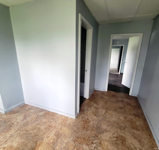 hallway featuring baseboards