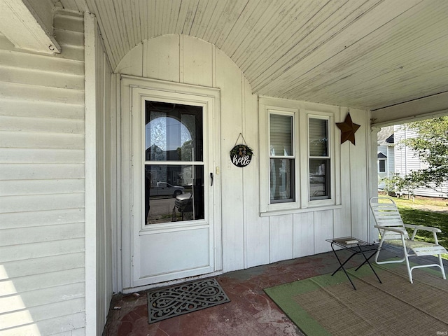 doorway to property featuring covered porch