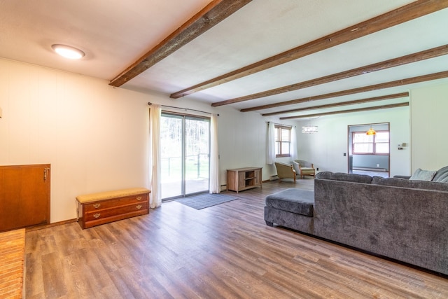 1360 N 140 W, Angola, IN 46703 - living room featuring wood finished floors, baseboard heating, and beam ceiling