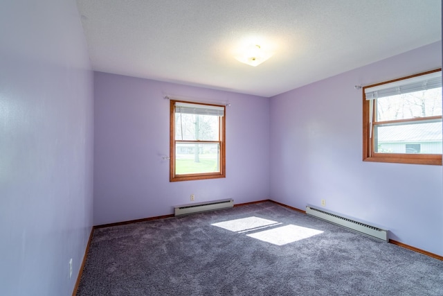 unfurnished room with baseboards, carpet, and a baseboard radiator