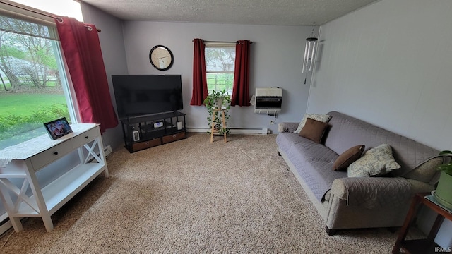 carpeted living area with heating unit, baseboard heating, and a textured ceiling