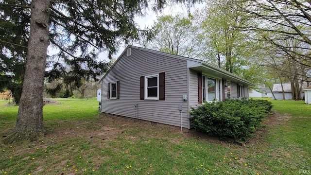 view of home's exterior featuring a yard